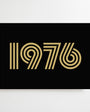 Black greetings card with 1976 printed in gold

