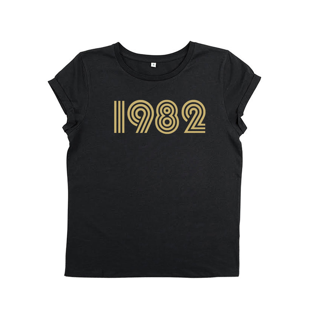 Black t-shirt with 1982 screen printed in gold ink. Birthday present and gifts