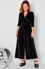 Black Rainbow Sparkle Jumpsuit with gold jewellery ad disco balls