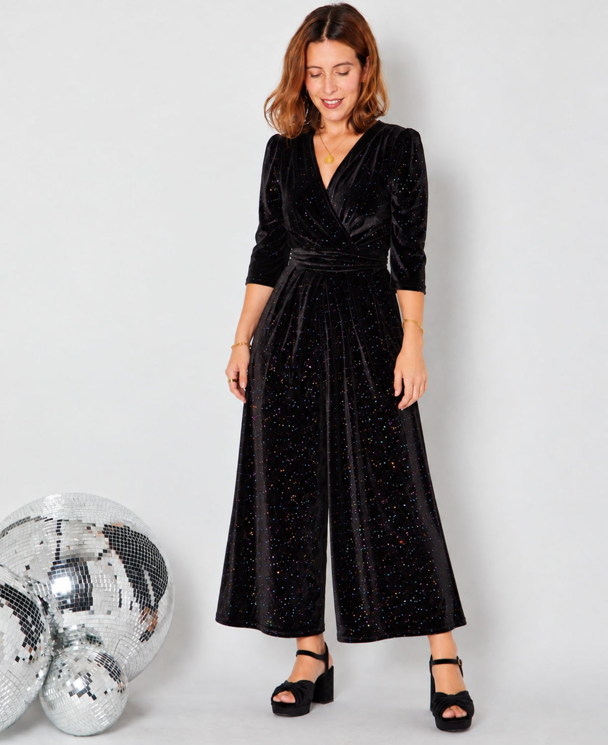 Black Rainbow Sparkle Jumpsuit with gold jewellery ad disco balls