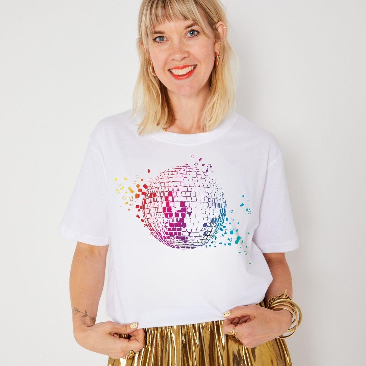 rainbow print disco ball on a white donna tshits disco down with gold skirt