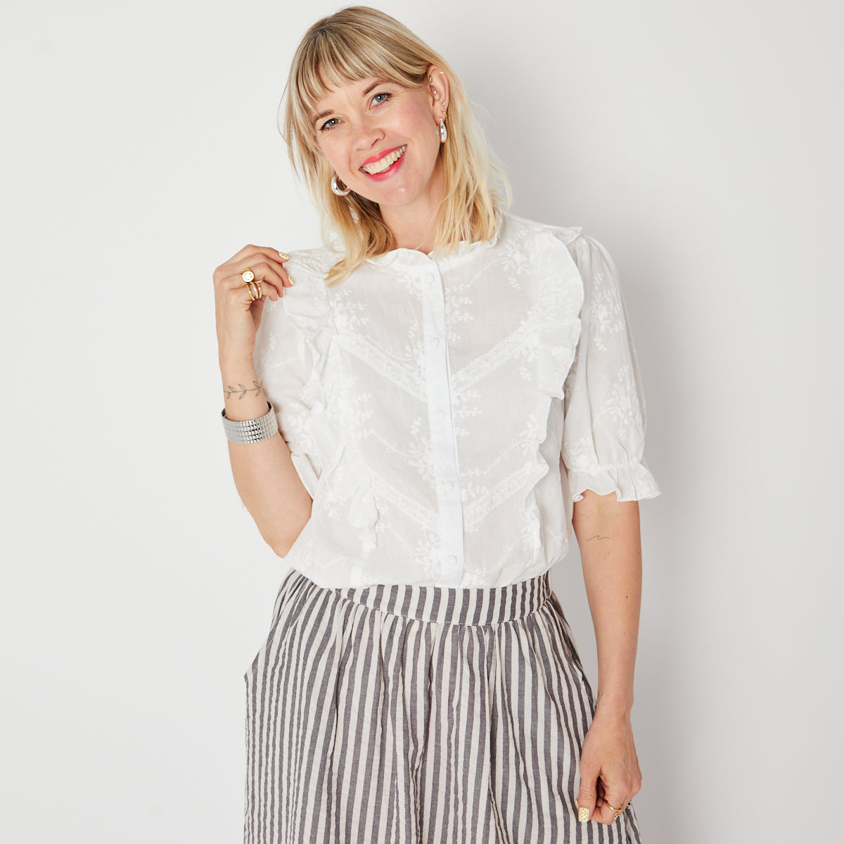 White floral embroidered blouse with frill detail