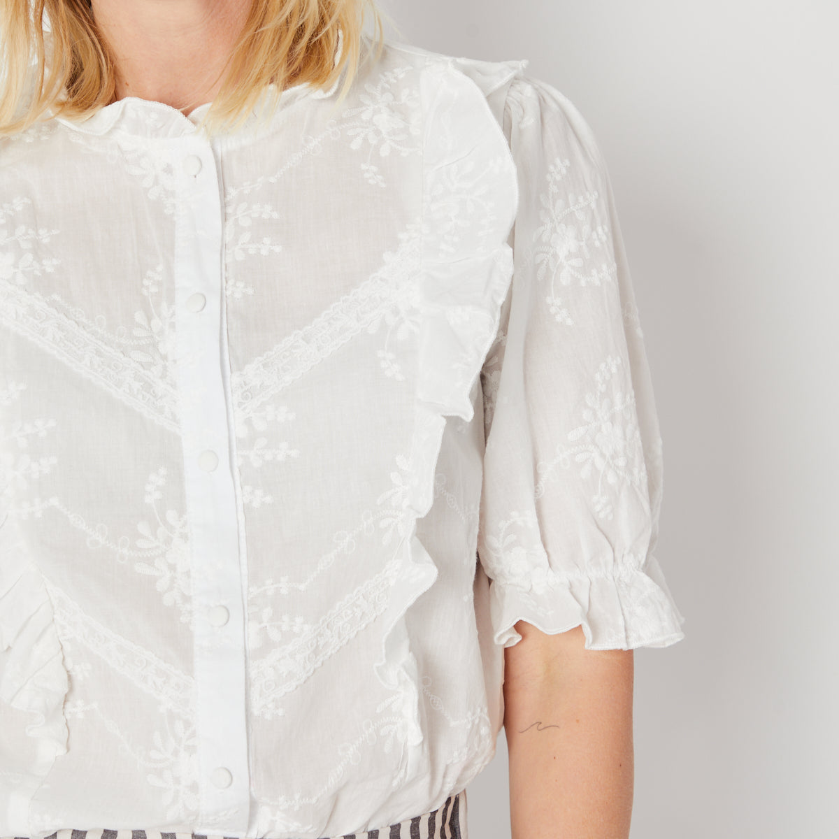 White floral embroidered blouse with frill detail