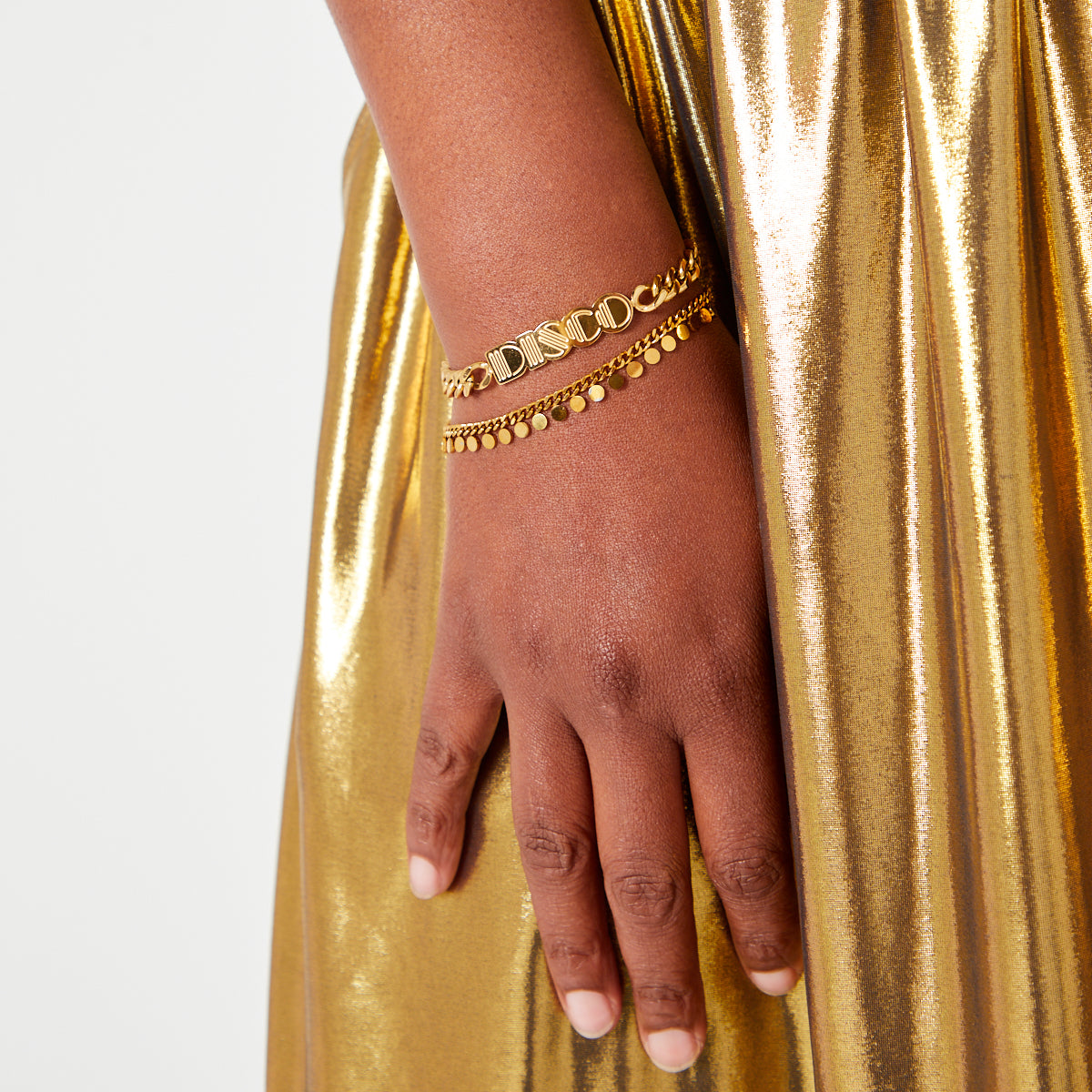 gold kerb chain bracelet with mini discs layering jewellery
