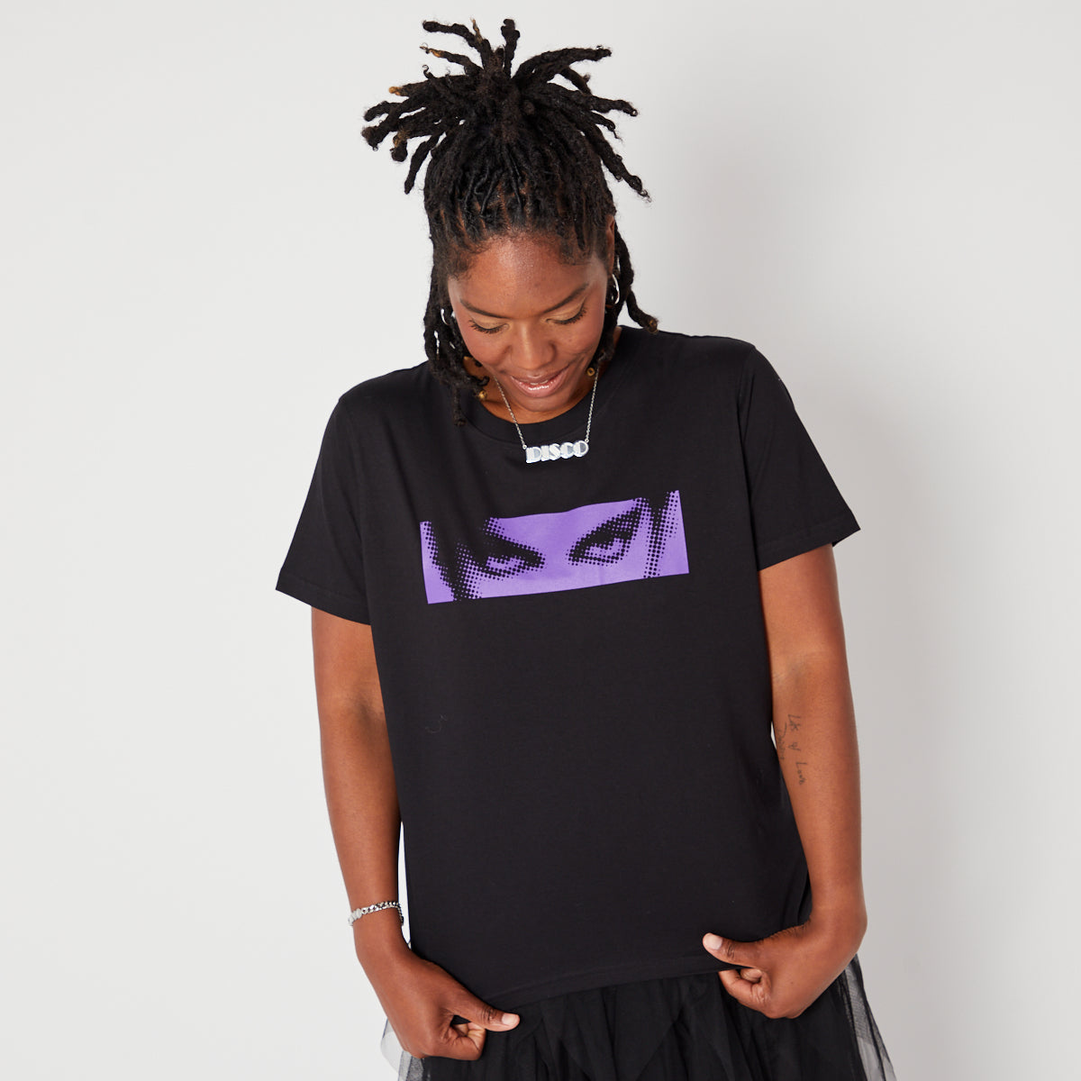 Black Womens Tshirt with Purple dots graphic of Prince's eyes inspired by Purple Rain