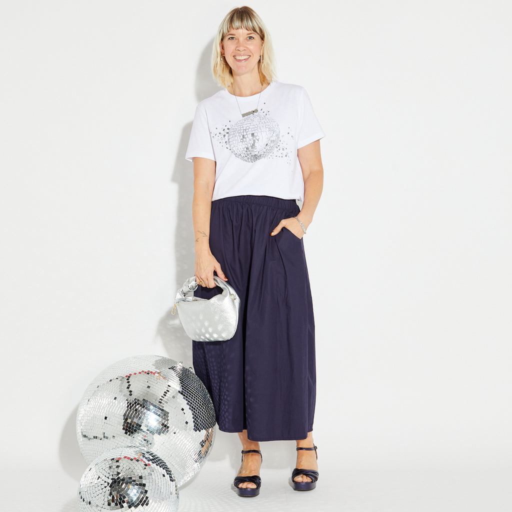 Disco down white tshirt and navy skirt