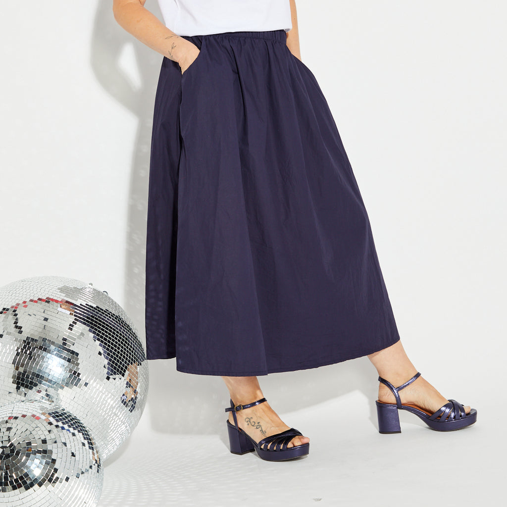 Navy blue A line skirt with a white disco ball t-shirt