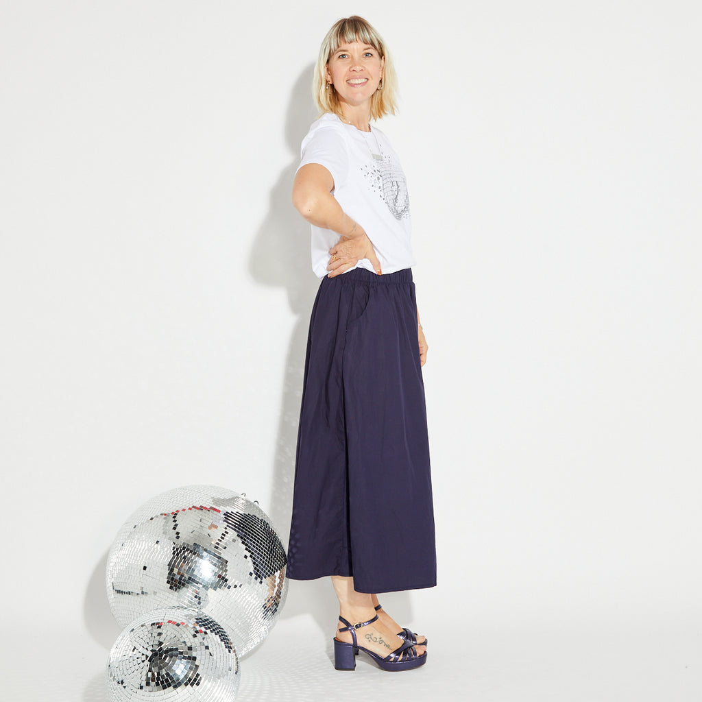 Navy blue A line skirt with a white disco ball t-shirt