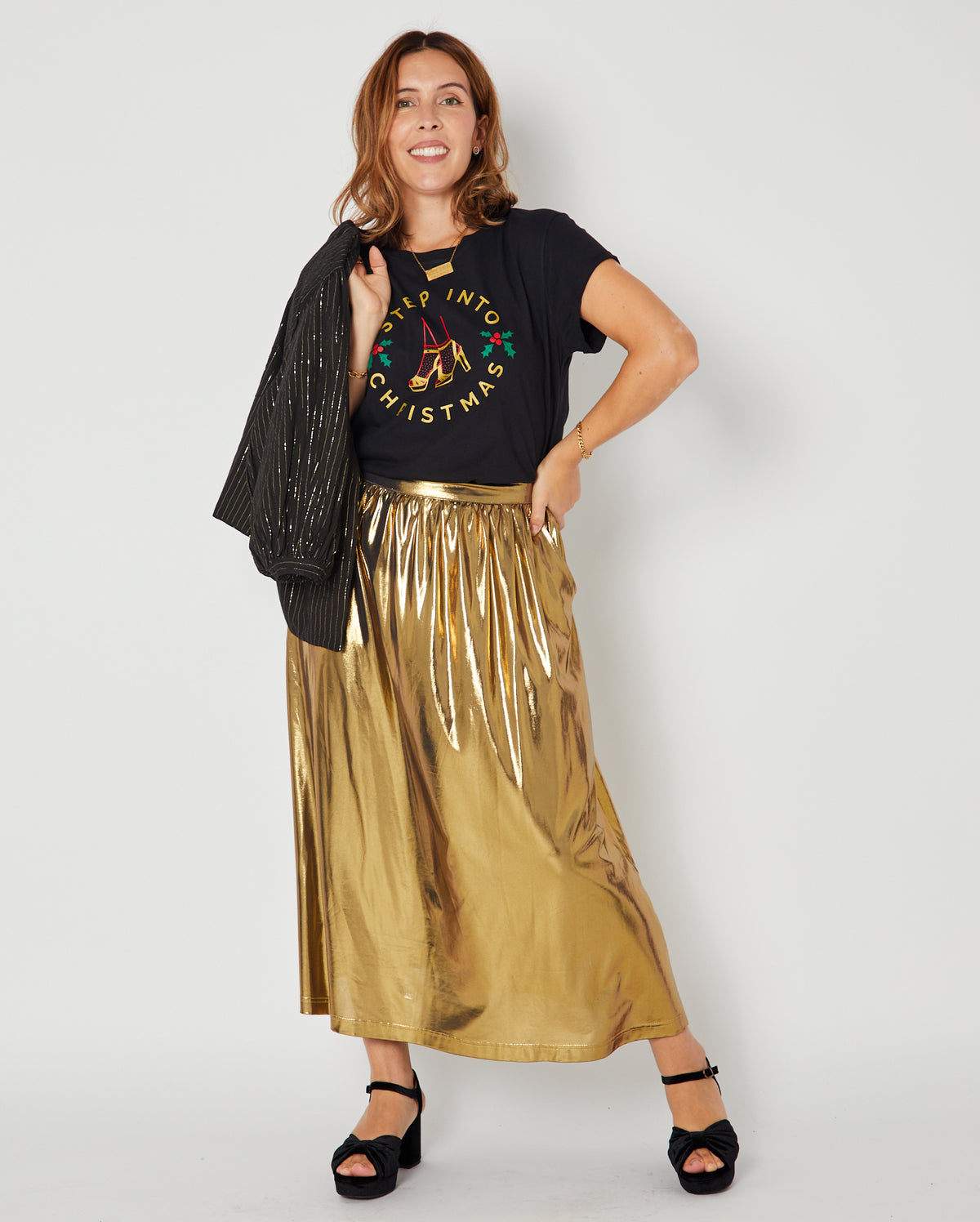 black heels christmas disco tshirt and gold skirt. Full christmas outfit
