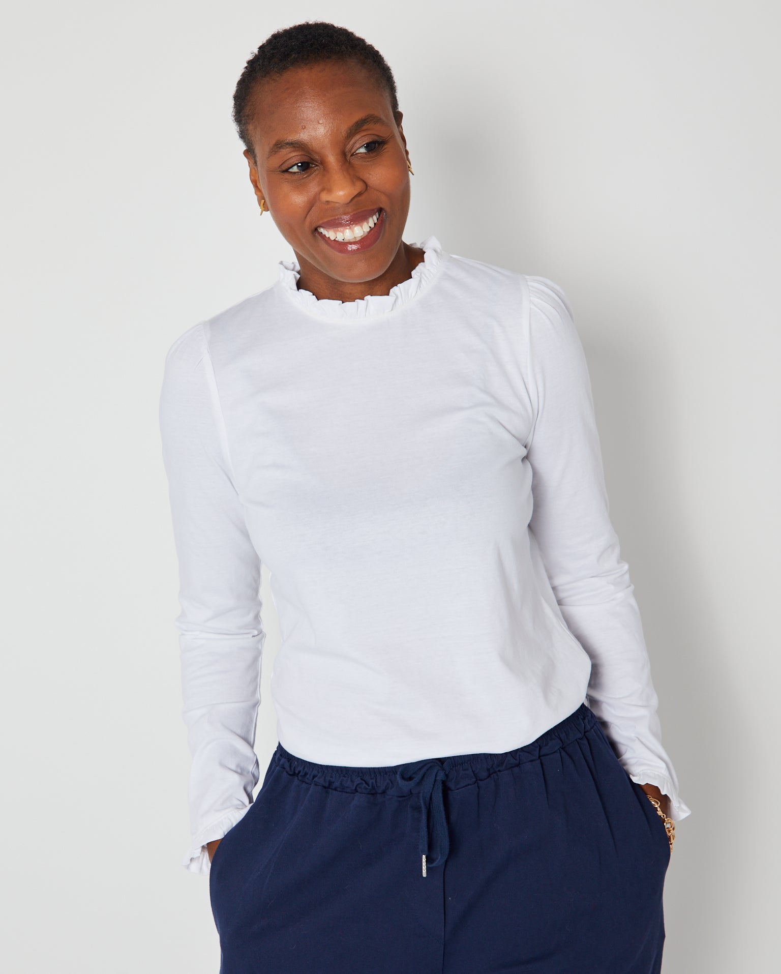 Bonnie Long Sleeve Ruffle Edge Top White with navy drawstring trousers