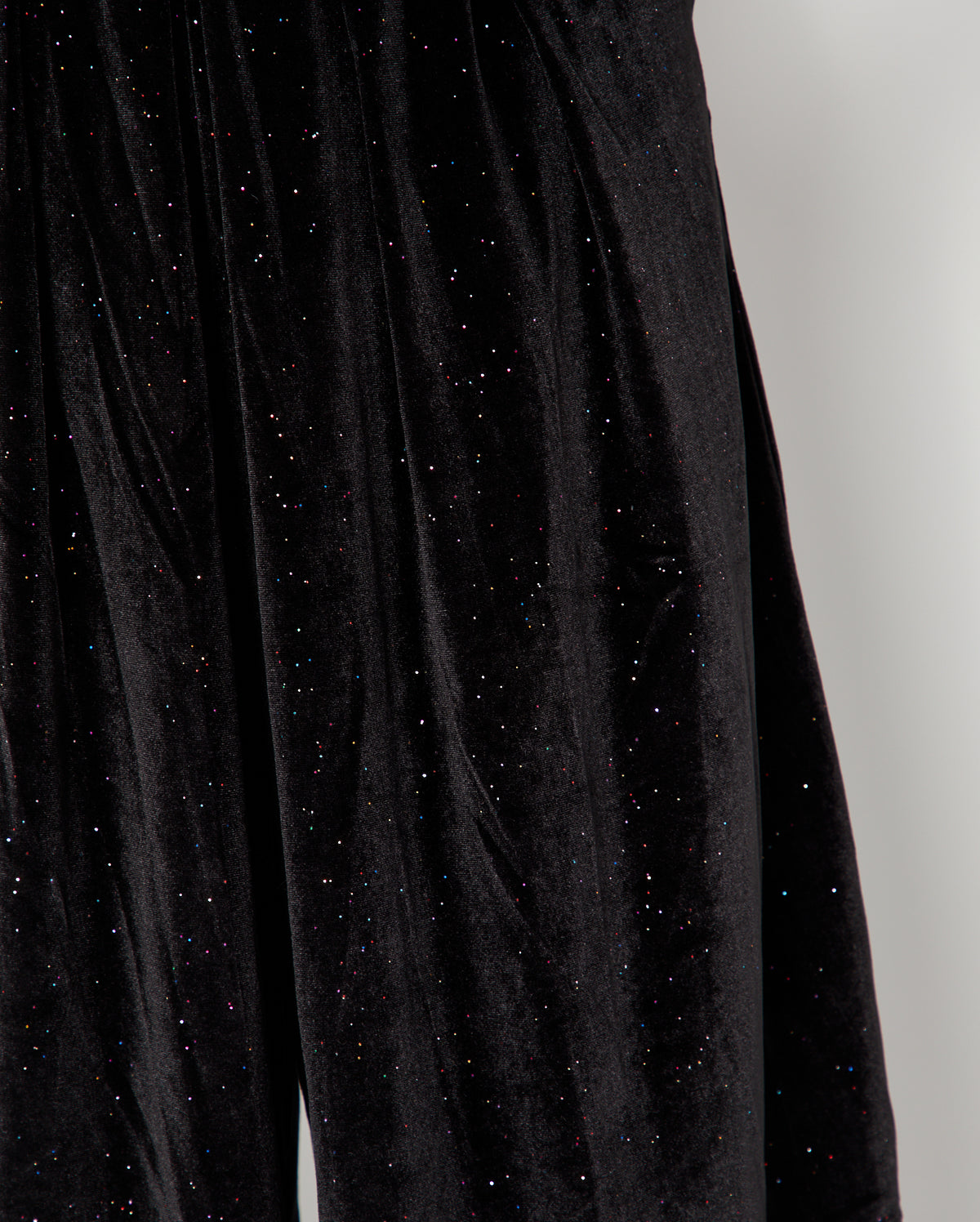 close up of the rainbow sparkle in the Black Rainbow Sparkle Jumpsuit