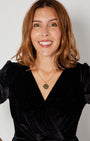 close up of Black Rainbow Sparkle Jumpsuit with disco ball pendant perfect forpartywear christmas party season