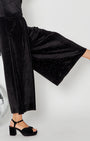 close up of the legs and waist of the Black Rainbow Sparkle Jumpsuit