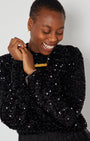 Black Sequin Long Sleeve Top styled with gold DISCO pendant close up