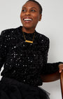 Black Sequin Long Sleeve Top sitting pose with gold necklace for christmas and party season