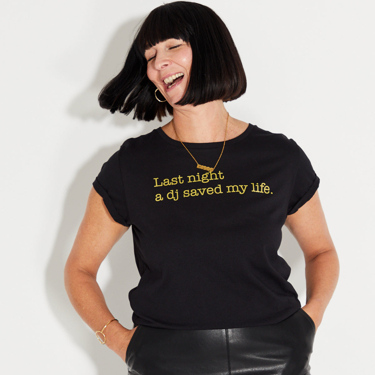 Womens Black t-shirt with 'Last Night A DJ Saved My Life' gold text - Disko Kids 
