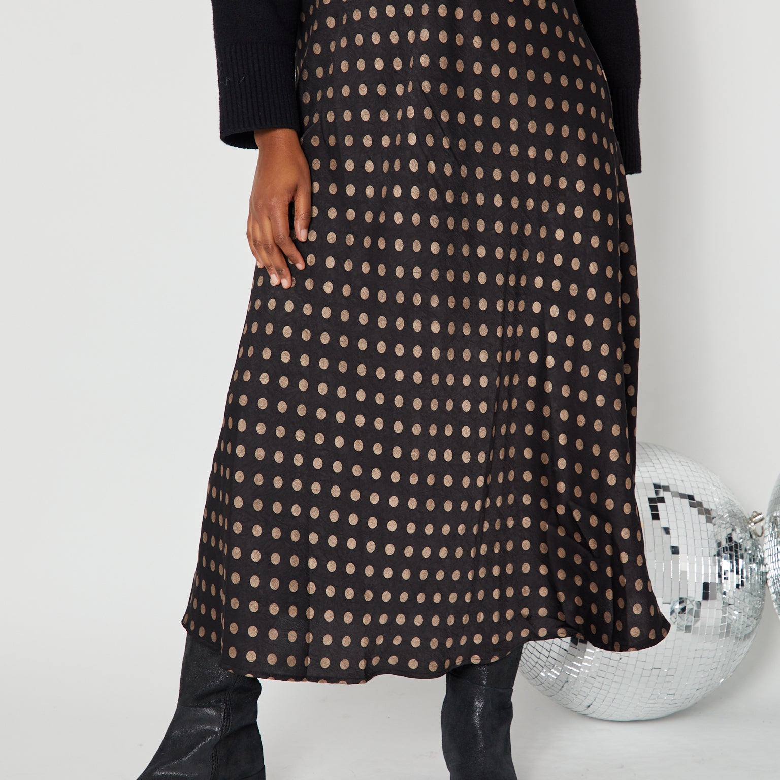 Polka Dot Satin Skirt black and gold close up with boots