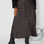 Polka Dot Satin Skirt black and gold close up with boots