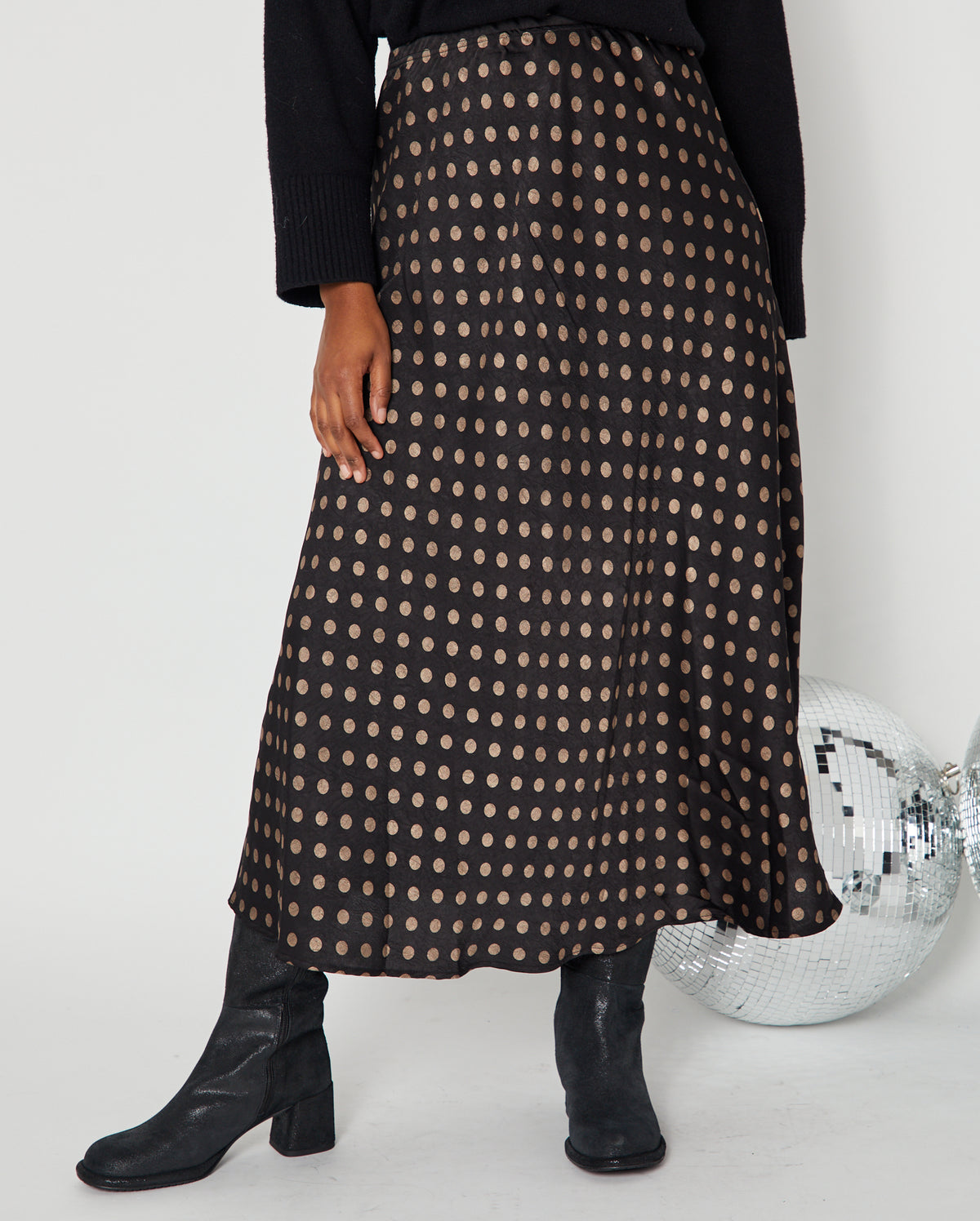 Polka Dot Satin Skirt black and gold close up with boots