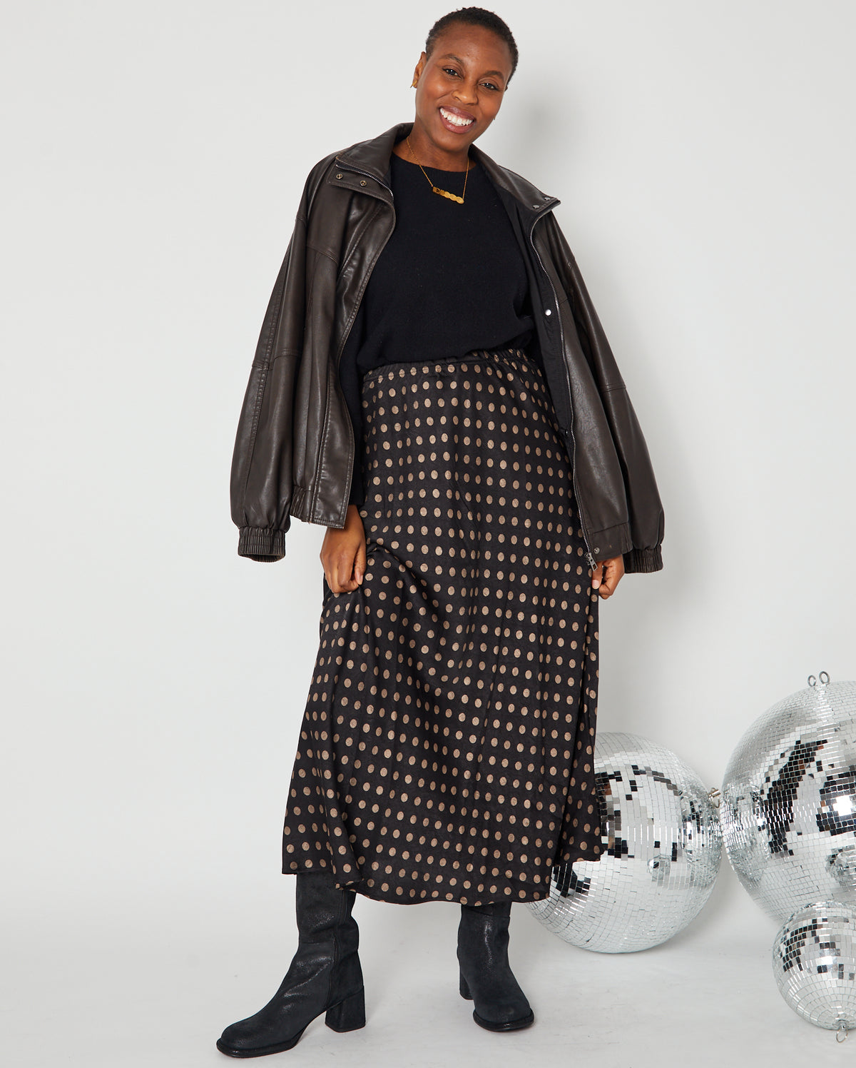 Polka Dot Satin Skirt black and gold full outfit with boots, knit and leather jacket for autumn winter