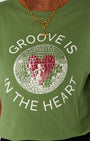 groove is in the heart graphic tshirt close up with Tbar necklace