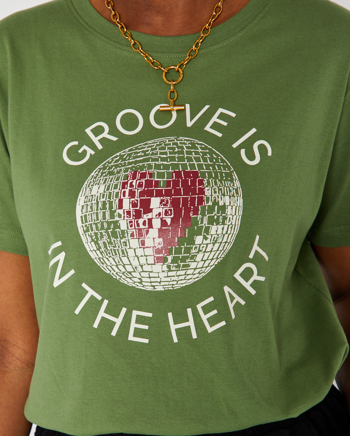 groove is in the heart graphic tshirt close up with Tbar necklace