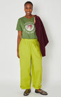groove is in the heart graphic tshirt full outfit with bright trousers and burgundy knit