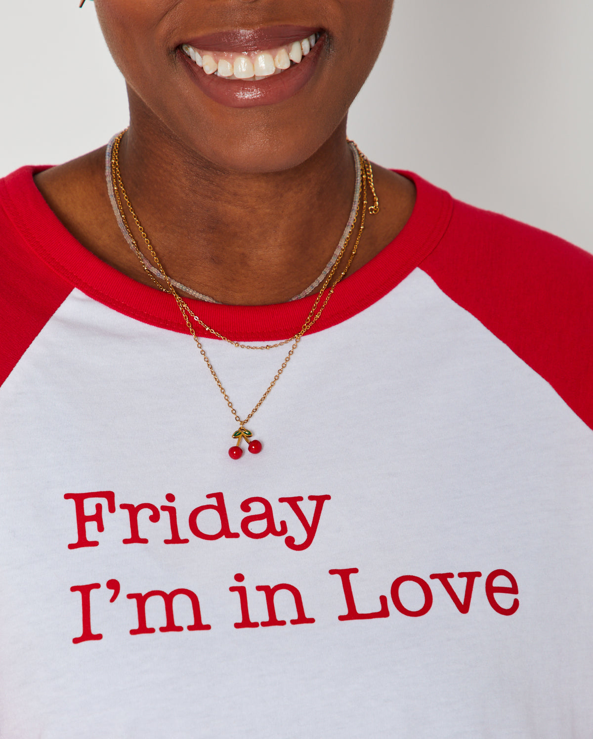 Friday I'm In Love raglan sleeve tshirt in red and wite close up of print with necklaces music inspired tshirt