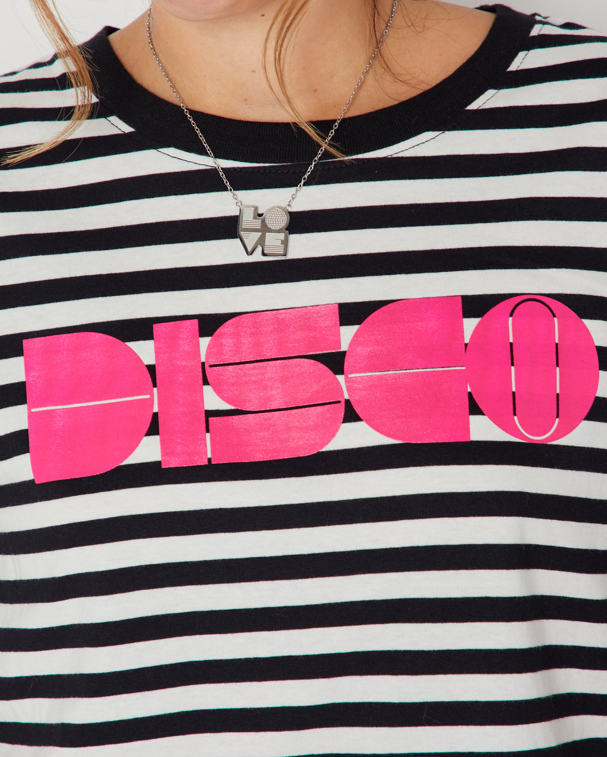 Disco Striped Donna Tshirt Pink close up of bold DISCO pink print and necklace
