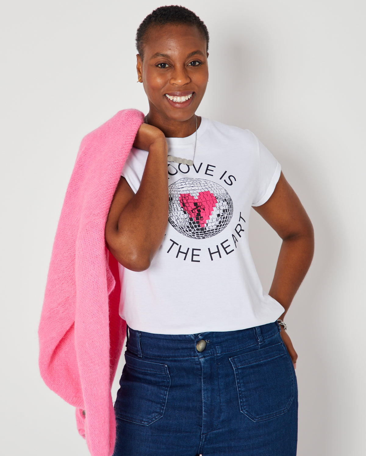 Groove Is In The Heart disco ball graphic tshirt disko kids styled with DISCO necklace and pink cardigan