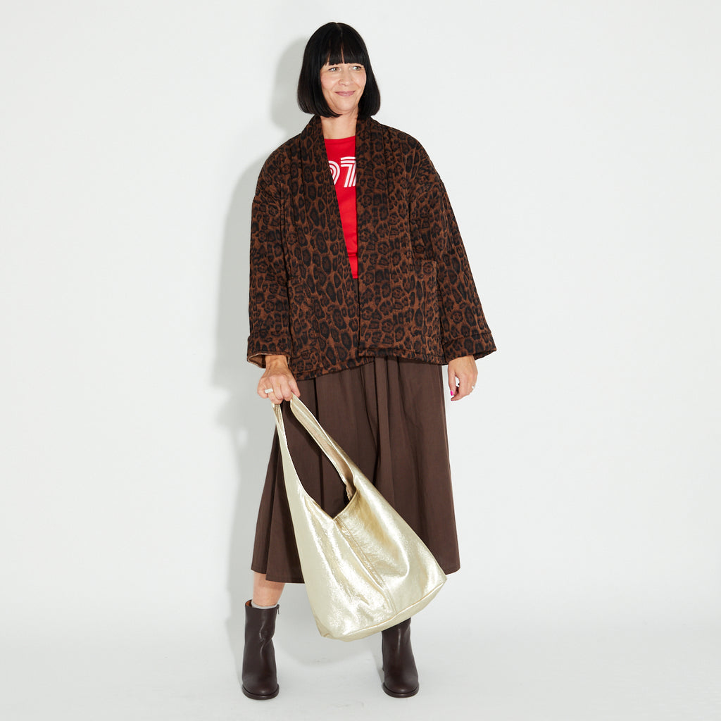 leopard print quilted jacket disko kids open front brown skirt and gold slouch bag