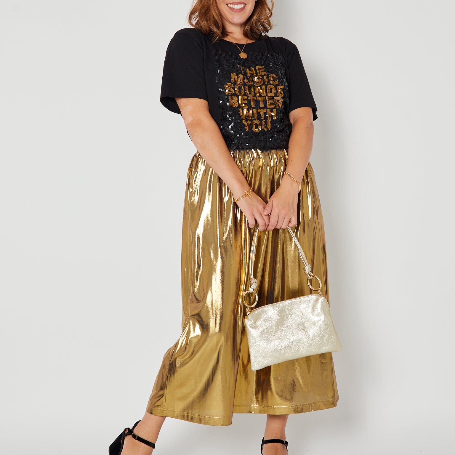 Gold metallic a line skirt full outfit styled with sequin Tshirt disko kids and party heels for christmas and party season
