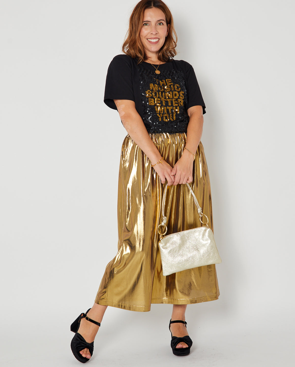 Gold metallic a line skirt full outfit styled with sequin Tshirt disko kids and party heels for christmas and party season