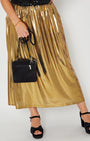 Gold metallic a line skirt close up with bag and heels