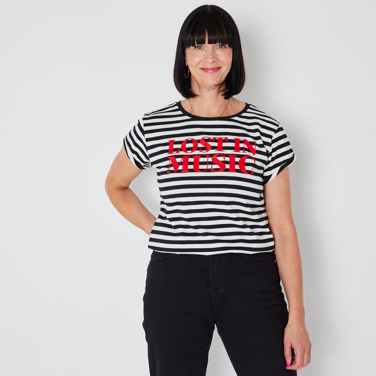 Black and white striped t-shirt with 'LOST IN MUSIC' text in red disko kids festival music inspired tshirts