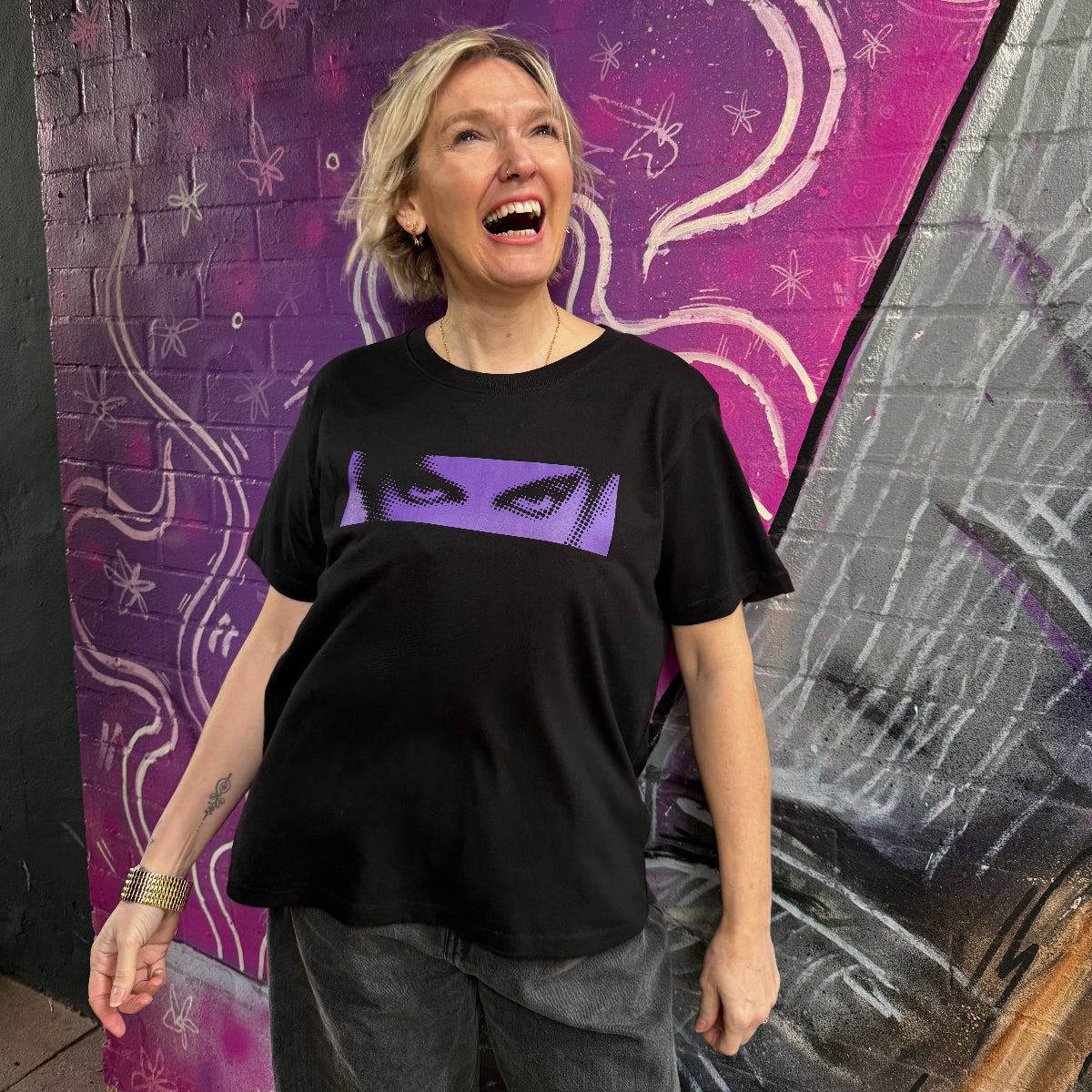 Black Womens Tshirt with Purple dots graphic of Prince's eyes inspired by Purple Rain
