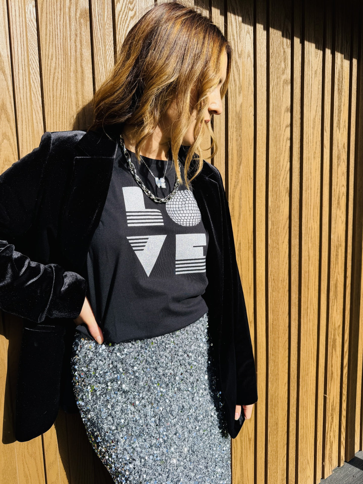 black rolled sleeve tshirt with love graphic and disco ball and silver sequin pencil skirt