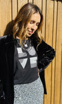 black rolled sleeve tshirt with love graphic and silver sequin pencil skirt