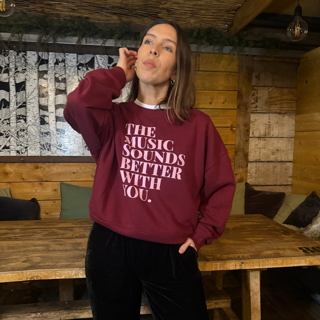 Womens burgundy sweatshirt with 'The Music Sounds Better With You' pink text - Disko Kids