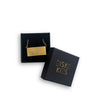 Gold necklace in a 'Disko Kids' box on a white background