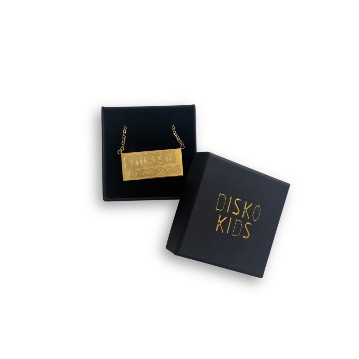 Gold necklace in a 'Disko Kids' box on a white background