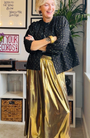 Gold metallic a line skirt full outfit styled with reversible jacket at home shot