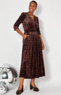 Leopard Print Velvet Jumpsuit full look with heels and disco balls for party season and christmas