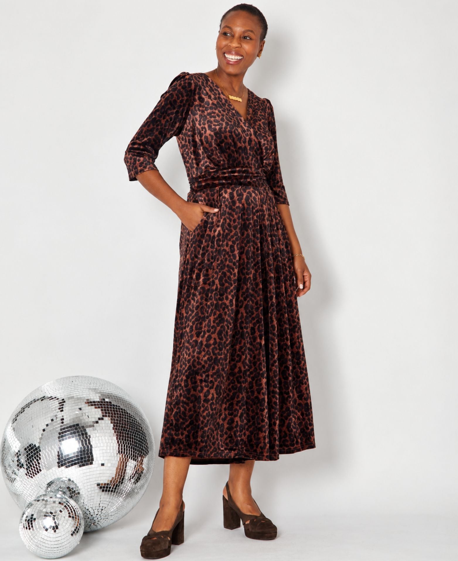 Leopard Print Velvet Jumpsuit full look with heels and disco balls for party season and christmas