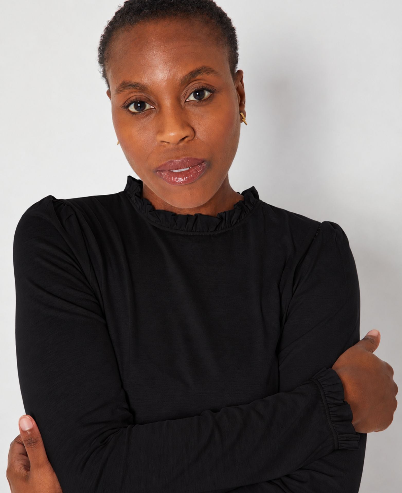 Bonnie Long Sleeve Ruffle Edge Top Black showing collar