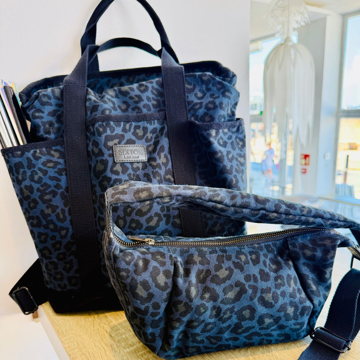 blue leopard print cross body and backpack