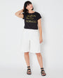 Womens black t-shirt with 'HALSTON GUCCI FIORUCCIO' gold text - Disko Kids