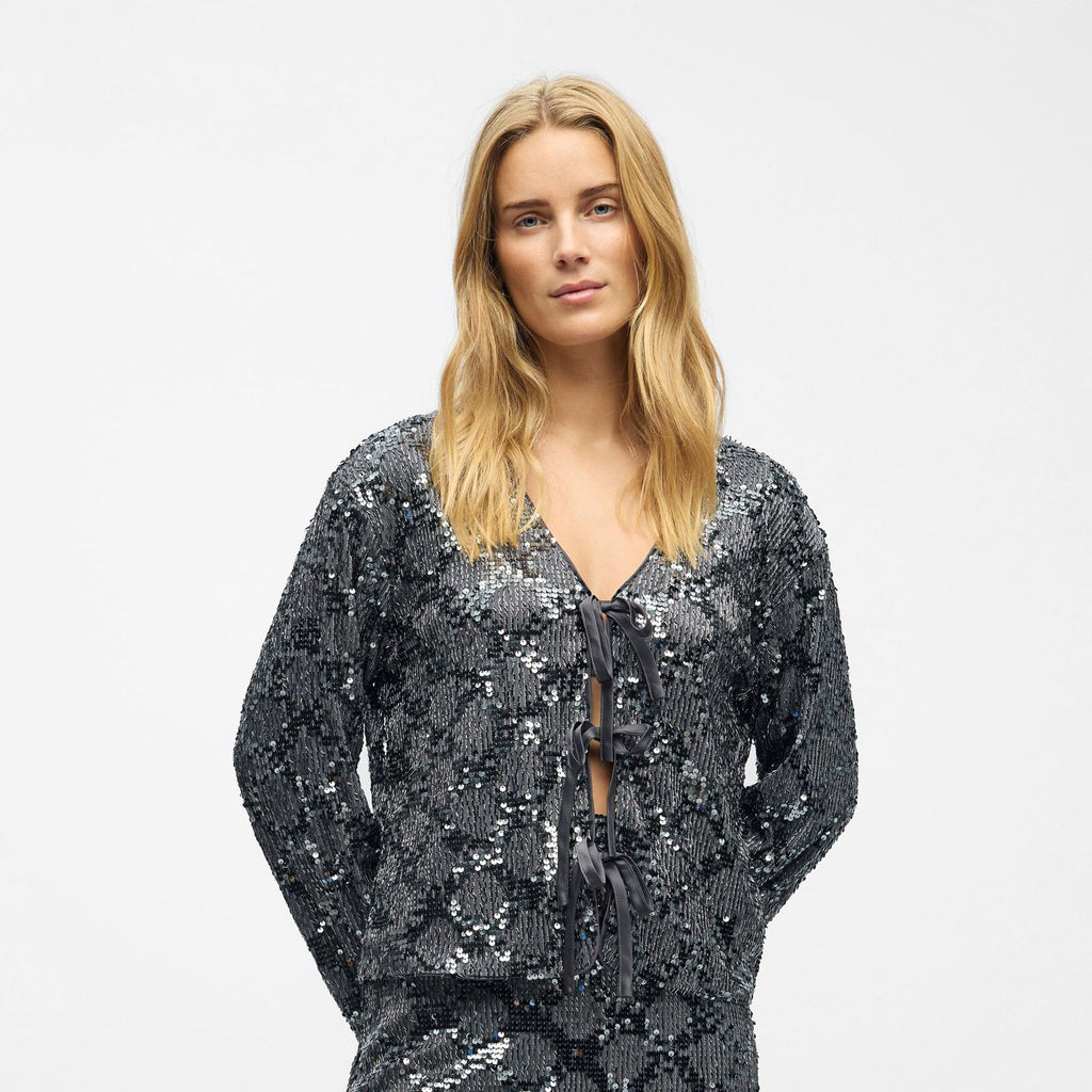 Silver sequin top with long sleeves and tie front