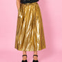 Gold metallic a line skirt close up styled with sequin Tshirt disko kids and party heels for christmas and party season showing pocket detail